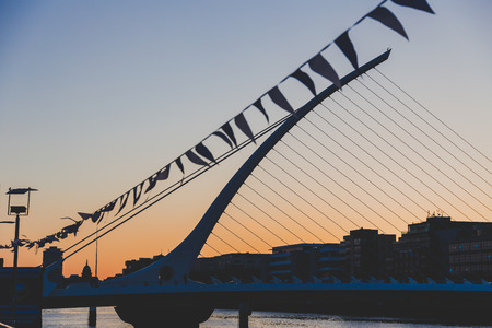 DUBLIN, IRELAND - June 3rd, 2018: the Samuel Beckett bridge on the river Liffey in Dublin at duskのeditorial素材