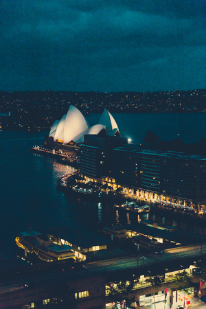 SYDNEY, AUSTRALIA - December 26th, 2014: skyscrapers in Sydney Circular Quay overlooking the harbour shot at duskのeditorial素材