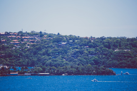 SYDNEY, AUSTRALIA - December 26th, 2014: view of Sydney Harbour, close-up shot of the coast and seaのeditorial素材