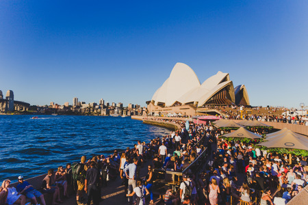 SYDNEY, AUSTRALIA - December 30th, 2014: Unidentified people at the Opera Bar overlooking the Sydney Opera Houseのeditorial素材