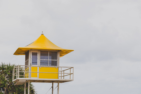 GOLD COAST, AUSTRALIA - January 5th, 2015: yellow lifeguard beach hut in Surfers Paradise on an overcast dayのeditorial素材