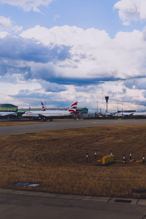 LONDON, UK - August 10th, 2018: view of Heathrow airport with stormy skies and British Airways airplanes at their standsのeditorial素材