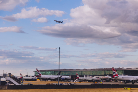 LONDON, UK - August 10th, 2018: view of Heathrow airport with stormy skies and British Airways airplanes at their standsのeditorial素材