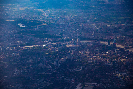 aerial view of the city of London from airplane window seat approaching landingの写真素材
