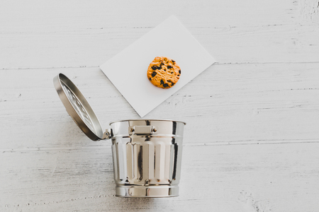 cookie going into a trash can, metaphor about website cookies and user tracking technologiesの写真素材