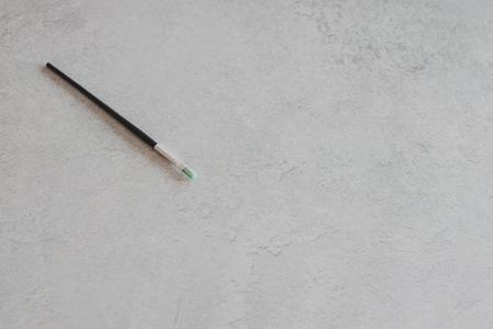 paintbrush on concrete surface with copyspace for your textの写真素材