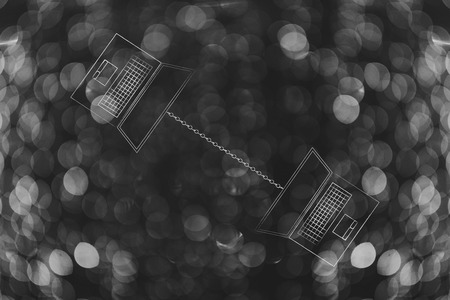 technology devices illustration: laptops facing opposite directions connected to each other with a chain metaphor of web linksの写真素材