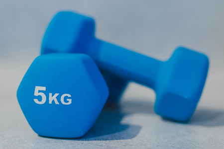health and fitness resolutions, heavy dumbbells on concrete surface shot at shalow depth of fieldの写真素材