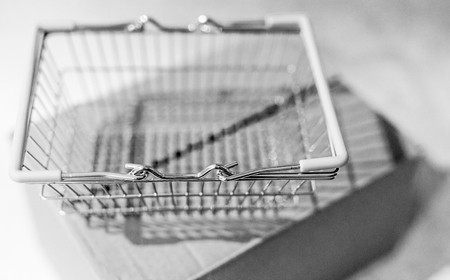 delivery parcel box with shopping basket, concept of online purchases and shippingの写真素材