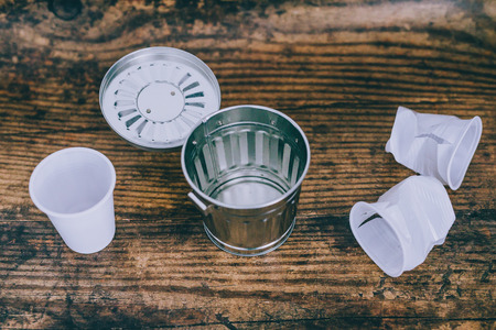 concept of banning or reducing single-use plastic, disposable cups and garbage bin