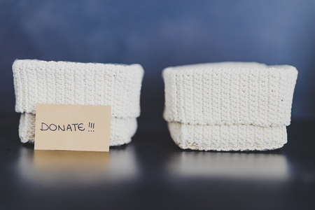 decluttering and tidying up concept: storage baskets to divide items to keep from those to declutter...