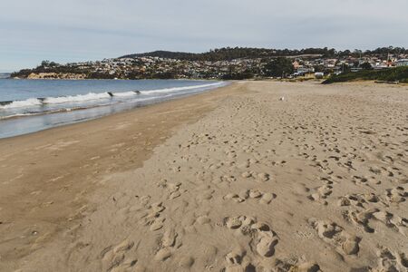 Seven Mile beach in Tasmania, Australia looking deserted n an overcast winter day