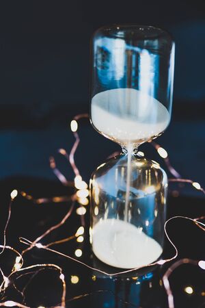 light bulb on clipboard surrounded by string lights, concept of new ideas at work