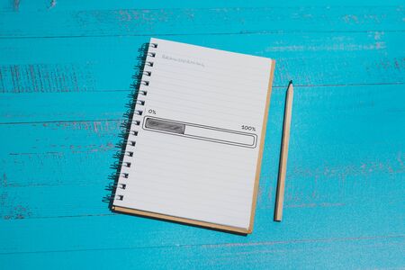 notebook with Brainstorming title on page and progress bar loading, concept of coming up with new...