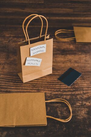 purchasing ethically sourced fair trade and eco-friendly items concept, shopping bag with...