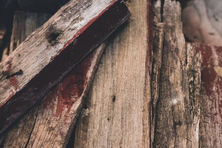 aged wood piled upto be used as kindlings, background or texture shotの写真素材
