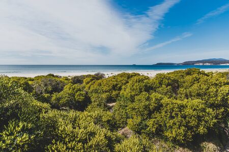 sunny pristine and deserted beach overlooking the South Pacific Ocean in Marion Bay along the East Coast of Tasmania Australiaの写真素材