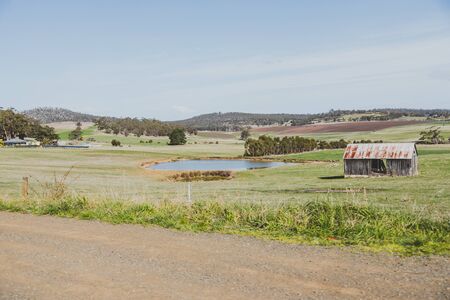 HOBART, AUSTRALIA - September 15th, 2019: countryside Tasmania with green fields and agricultural exploitations on a road trip from Hobart to Marion Bayのeditorial素材