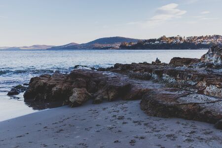 HOBART, AUSTRALIA - September 19th, 2019: Tasmanian beach landscape view in Hobart shot at dusk with soft lightのeditorial素材