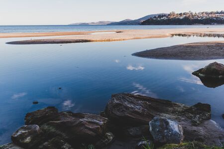 HOBART, AUSTRALIA - September 19th, 2019: Tasmanian beach landscape view in Hobart shot at dusk with soft lightのeditorial素材
