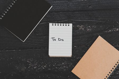 setting up for success conceptual still-life, business desk with variety of notebooks with To Do text on itの写真素材