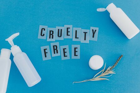 vegan beauty products against animal testing conceptual still-life, mixed lotion bottles with Cruelty Free text and leaves metaphor of ethically sourced natural ingredientsの写真素材