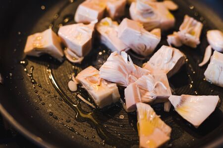 healhy food ingredients for a plant-based diet concept, pulled jackfruit getting sauteed in a pan the fruit is used as mock chicken in vegan nutritionの写真素材