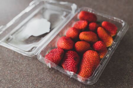 fresh healthy food ingredients concept, organic strawberries on kitchen benchtopの写真素材