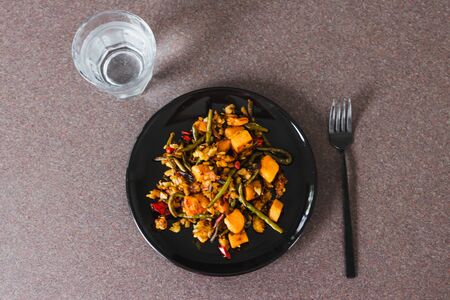 healthy plant-based recipes concept, mixed sauteed mediterranean veggies with dismantled hash brown and nutritional yeastの写真素材