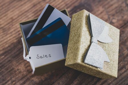 global marketing and promotional offers conceptual still-life, present box with payment or gift...