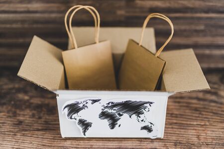 online shopping and international deliveries conceptual still-life, parcel with world map and...