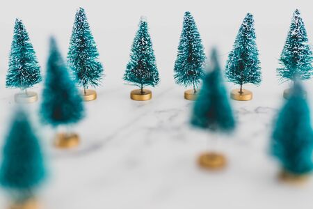 festive season's decorations conceptual still-life, group of miniature Christmas trees shot at...