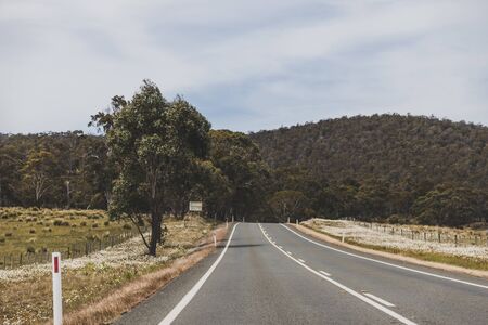 HOBART, AUSTRALIA - December 8th, 2019: Australian countryside road trip view from the car with...