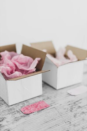 competition and similar products conceptual still-life, delivery parcel boxes side by side with...