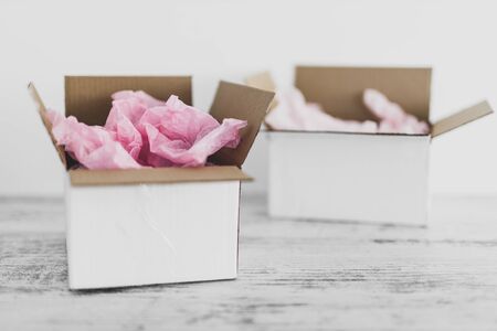 competition and similar products conceptual still-life, delivery parcel boxes side by side with...