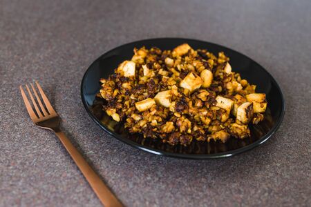 healthy plant-based recipes, sauteed potatoes with marinated tofu cubesの写真素材