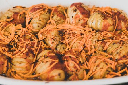 healthy plant-based recipes, potato bake with carrots and tomato sauceの写真素材