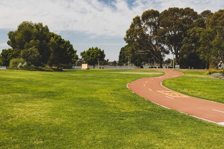 PERTH, WESTERN AUSTRALIA - December 26th, 2019: public park area with cyclist lane near the...
