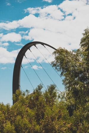 PERTH, WESTERN AUSTRALIA - December 25th, 2019: Elizabeth Quay's pedestrian bridge over the bay and...