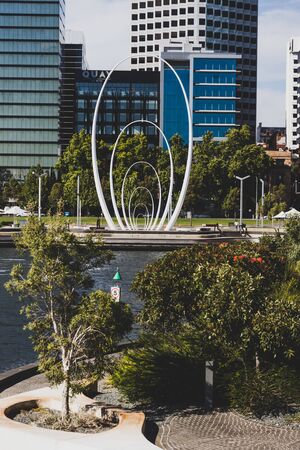 PERTH, WESTERN AUSTRALIA - December 24th, 2019: the Spanda sculpture on Elizabeth Quay's in Perth CBD and skyline view of some of the city's skyscrapersのeditorial素材