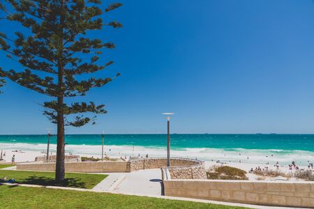 PERTH, WESTERN AUSTRALIA - December 27th, 2019: detail of Scarborough beach, one of the most popular beaches near Perth on the Indian Ocean, with intense turquoise water and blue sky with strong sunshine, shot during the Christmas holidays in the Australiのeditorial素材