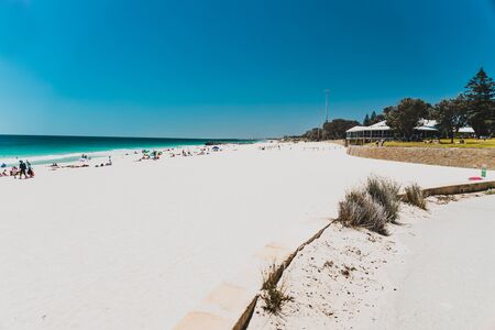 PERTH, AUSTRALIA - January 5th, 2020: view of City Beach near Perth with white sand and turquoise waters of the Indian Ocean with tourists and locals enjoying the sunshineのeditorial素材