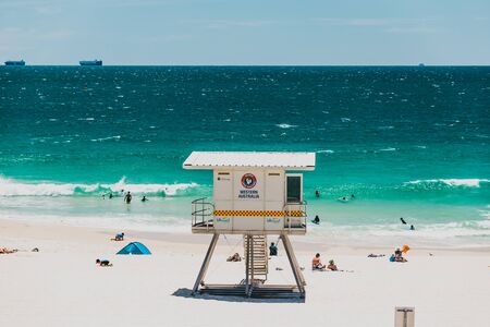 PERTH, AUSTRALIA - January 5th, 2020: view of City Beach near Perth with white sand and turquoise waters of the Indian Ocean with tourists and locals enjoying the sunshineのeditorial素材