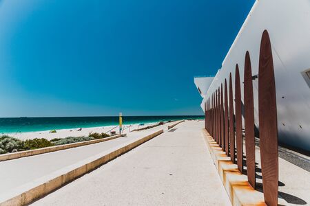 PERTH, AUSTRALIA - January 5th, 2020: view of City Beach near Perth with white sand and turquoise waters of the Indian Ocean with tourists and locals enjoying the sunshineのeditorial素材