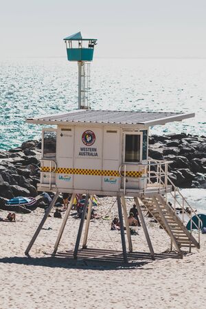 PERTH, AUSTRALIA - January 5th, 2020: view of City Beach near Perth with white sand and turquoise waters of the Indian Ocean with tourists and locals enjoying the sunshineのeditorial素材