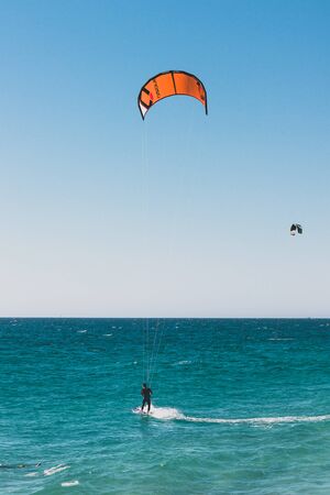 PERTH, AUSTRALIA - January 5th, 2010: kitesurfers in the water at City Beach, one of the most...