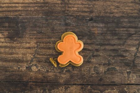 festive gingerbread cookies in different colors and shapes, a traditional treat for the Christmas...