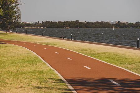 PERTH, WESTERN AUSTRALIA - January 9th, 2020: detail of the Riverside walk along the Swan River from Perth CBD on a sunny and warm summer dayのeditorial素材