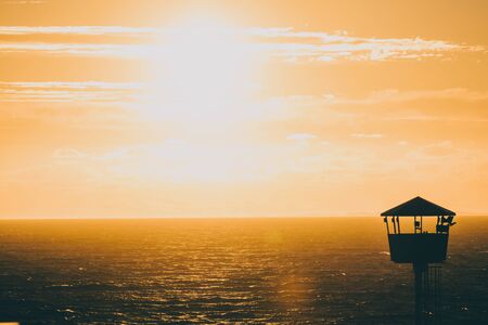 PERTH, WESTERN AUSTRALIA - January 8th, 2020: view of the sunset over the Indian Ocean at City Beach, one of the most popular beaches near Perth on a warm summer dayのeditorial素材