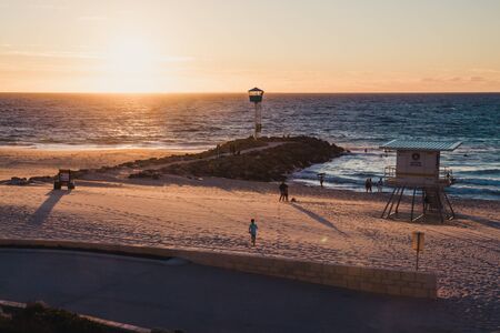 PERTH, WESTERN AUSTRALIA - January 8th, 2020: view of the sunset over the Indian Ocean at City Beach, one of the most popular beaches near Perth on a warm summer dayのeditorial素材